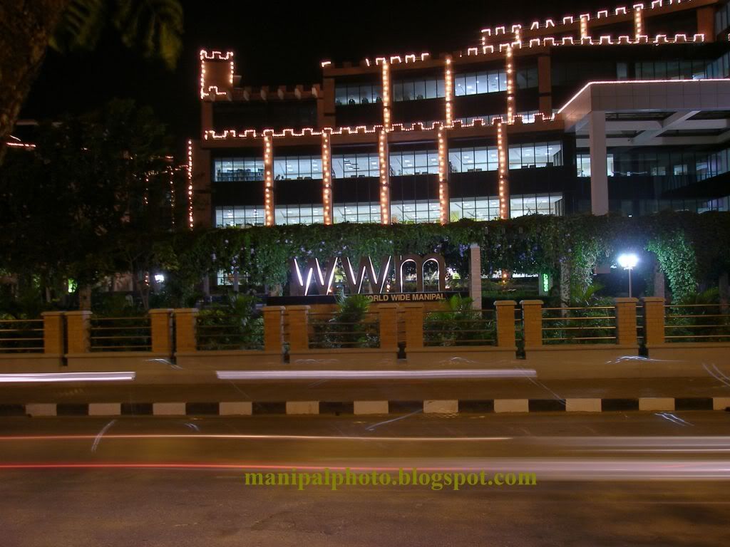 Photograph of the Manipal University Health Sciences library lit up for convocation